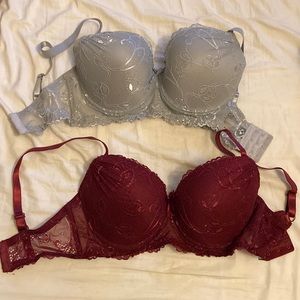 Two brand new 36D lacey underwire bras. Burgundy and grey.